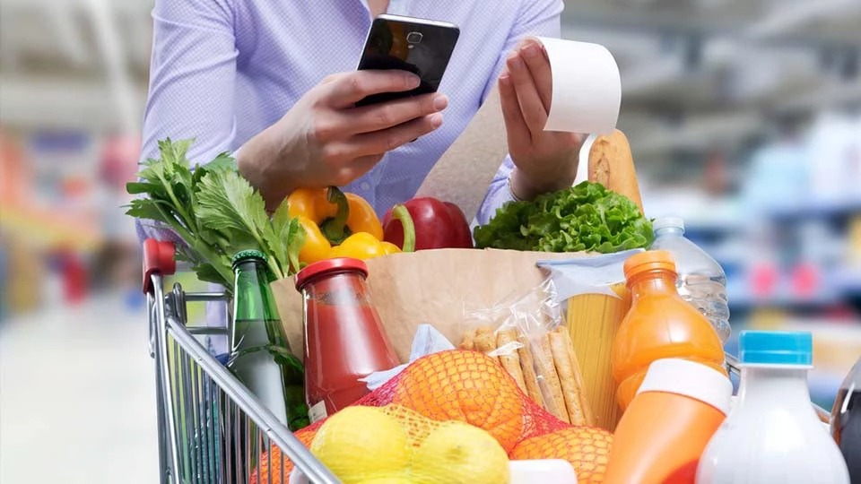 tcard woman checking groceries r
